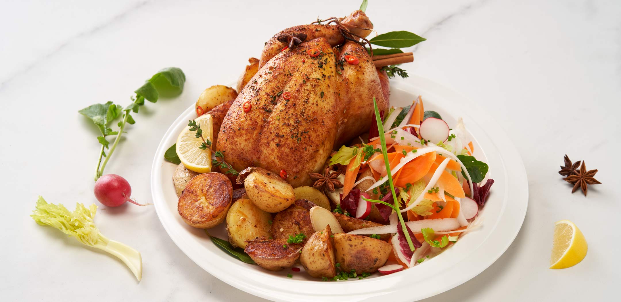 Baked Chicken Marinated in Soy Sauce, Ginger, Star Anise, Cinnamon and Lemon with Baby Potatoes in Butter and Root Vegetable Salad